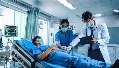 Doctor and nurse assessing patient in emergency room | Premium AI ...