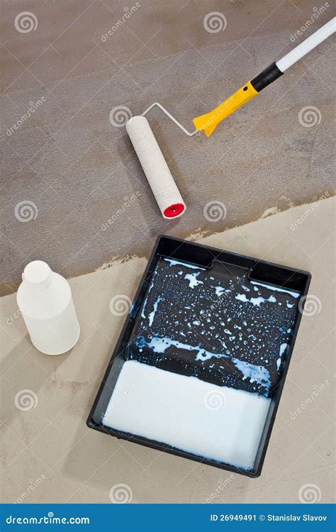 Primer For Concrete Floor. The Master Lays Liquid Soil On A Concrete ...