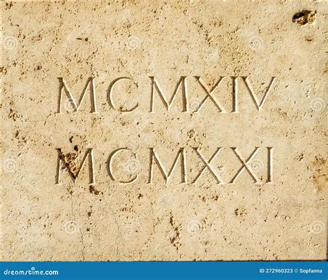 Roman Numerals MCMXIV and MCMXXI Engraved in White Stone. Translation ...