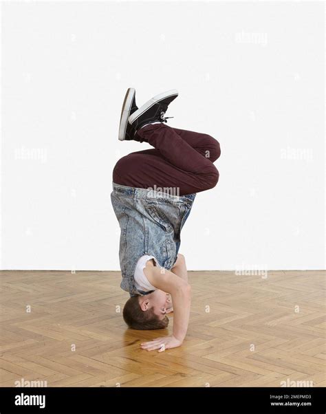 Teenager performing breakdance moves Stock Photo - Alamy