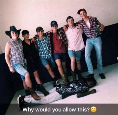 Moody High School racist photo. White students standing on black boy joke
