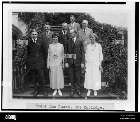 President and Mrs. Coolidge, standing on steps, with their two sons, Mr ...
