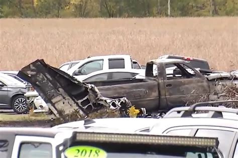 2 dead after small plane crashes into Ohio car dealership