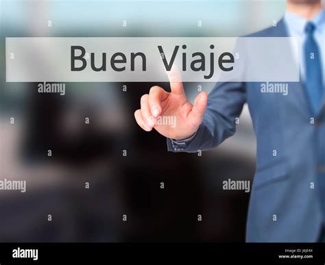 Buen Viaje (Good Trip in Spanish) - Businessman hand touch button on ...