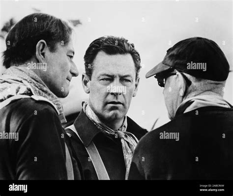 THE HORSE SOLDIERS, from left: John Wayne, William Holden, director ...