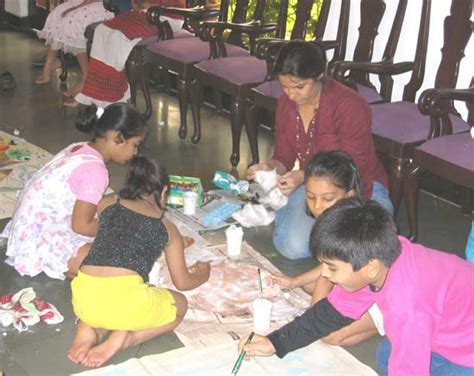 Children painting jute panels to raise funds for tsunami relief