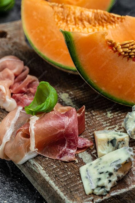 Premium Photo | Cantaloupe melon with ham prosciutto jamon traditional ...