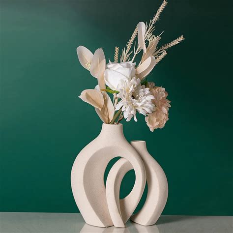 How to style designer flowerpot in a display cabinet to make an impact ...