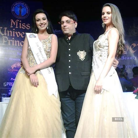 Designer Mannu Rawal poses with models during Miss Universe princess a ...