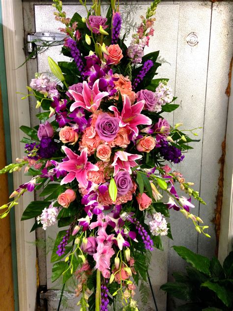 Funeral Standing Spray with pinks and violets focal flowers being pink ...