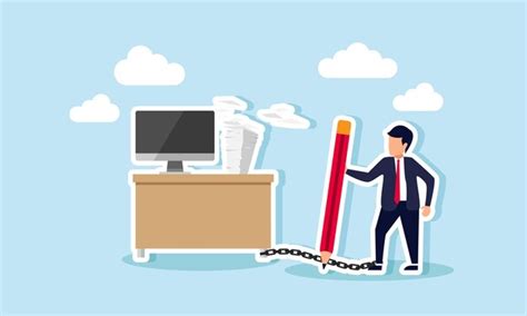 A businessman standing with chained feet beside a desk full of ...