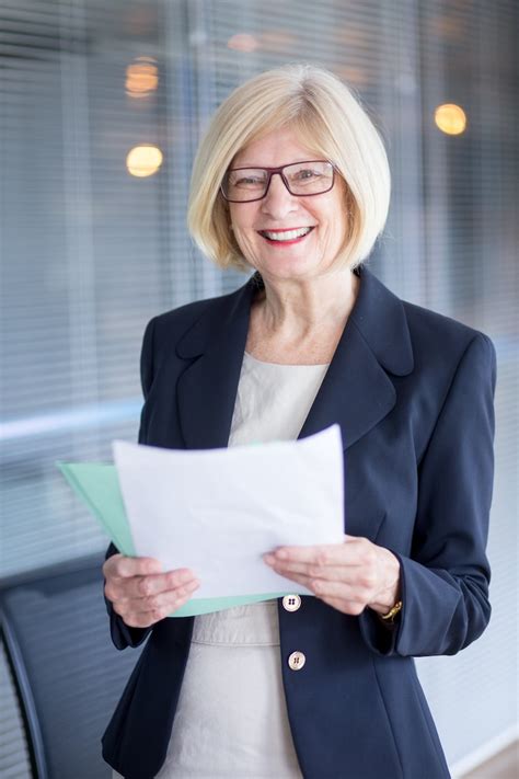 Smiling lady with paperwork Images - Free Download on Freepik