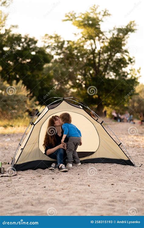 Mother and Son Sitting in Camping Tent, Admiring Sunrise on the River ...