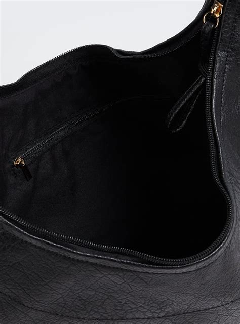 Buy Women Textured Shoulder Bag with Side Ties Online at just Rs. 1299. ...