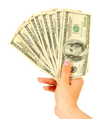Female hand with dollars close up isolated on white | Premium Photo