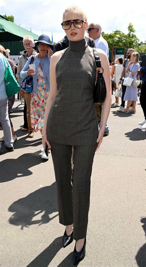 Ellie Bamber Attends Day 8 of Wimbledon and the Evian Mountain of Youth VIP Suite in London 07 ...