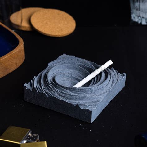 Cyclone Dark Concrete - Spiral Design ashtray resting on a square base ...