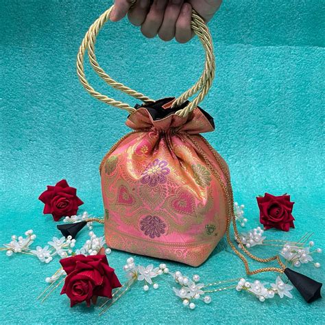 Baby Pink Elegance Banarasi Potli Bags – Unique Threads Sarees