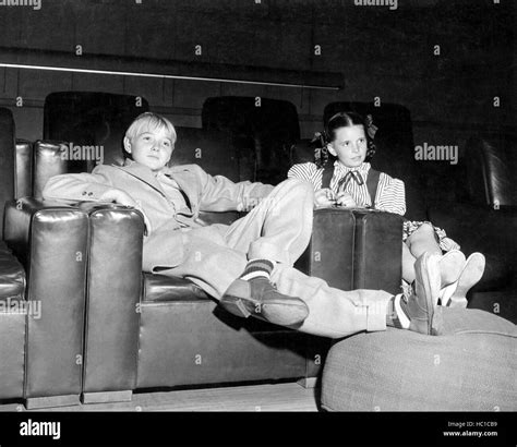 Margaret O'Brien (right) and Claude Jarman, Jr. watch movies in an MGM ...