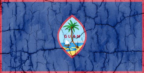 Premium Photo | Flag of guam on cracked wall textured background