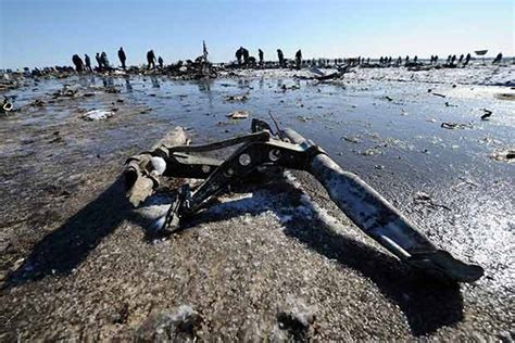 Russian workers comb debris-laden plane crash site