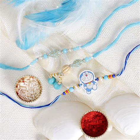 Send Blue Fancy Bhai Bhabhi with Doraemon Kid''s Rakhi Set Online ...