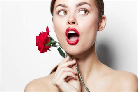 Model naked shoulders surprised look towards the rose flower | Premium ...
