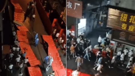 Coronavirus in China: Frustrated residents spark protest, tear down ...