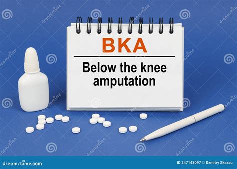 On a Blue Background, a Pen, Tablets and a Notepad with the Inscription ...