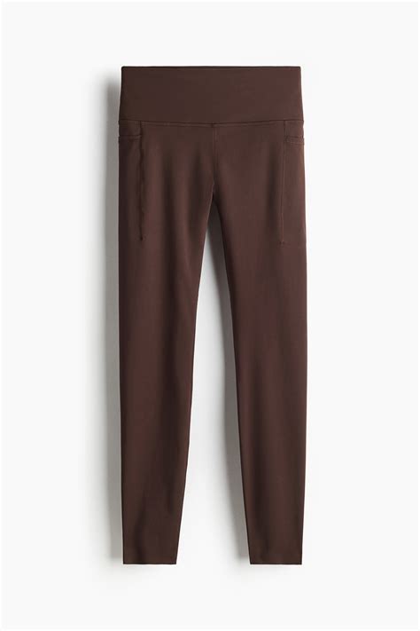 Pocket-detail sports leggings with DryMove™ - Warm brown - Ladies | H&M IN