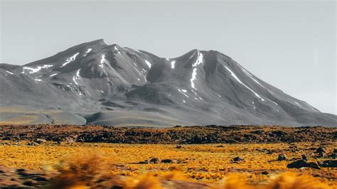 Download wallpaper 1600x900 mountains, peaks, landscape, bushes, stones ...