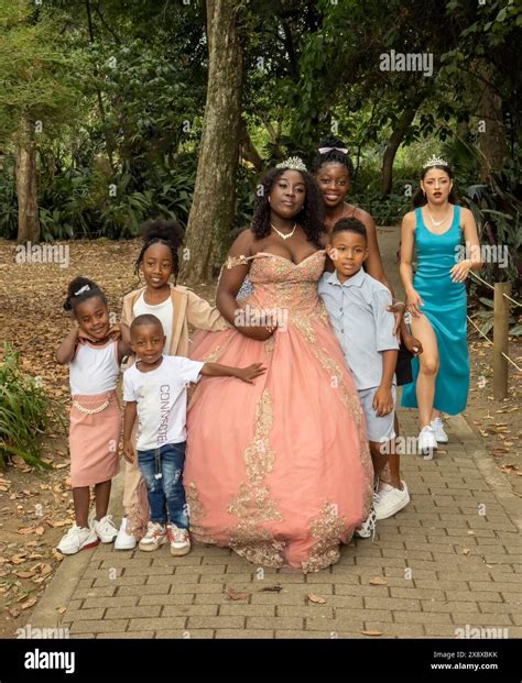 A black girl celebrates her qQuinceañera at the Botanical Gardens in ...