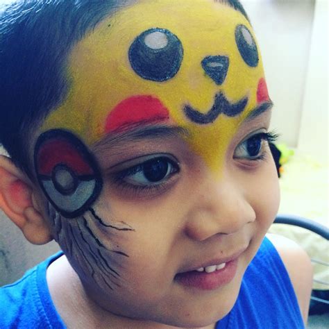 Bilal on pikachu face paint