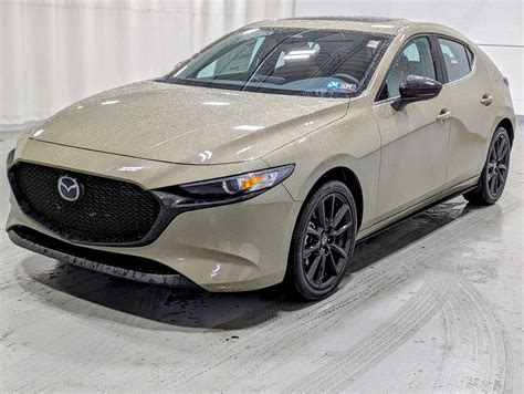 New 2024 Mazda Mazda3 Hatchback 2.5 Carbon Turbo in Zircon Sand Metallic | Greensburg, PA | #Z02879