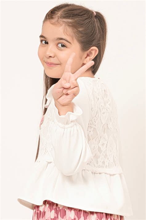 One Friday Varsity Chic Off-White Top with Playful Pink Bow Detail for