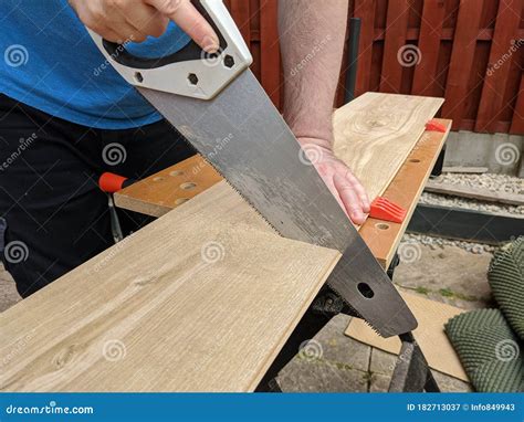Saw Cutting Laminate Floor Piece for DIY Home Improvement Stock Image ...