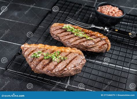 Grilled Top Sirloin or Cup Rump Beef Meat Steak on a Rack. Black ...