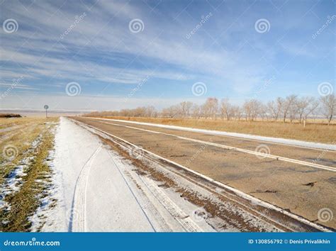 Winter Landscape with Asphalt Road, Bare Trees and First Snow Under ...
