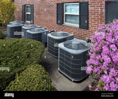 Air conditioning units outside an apartment complex Stock Photo - Alamy