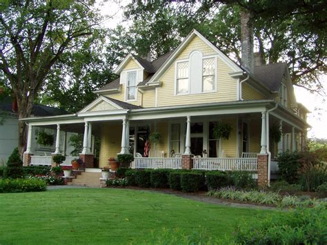 White Brick House Wrap Around Porch