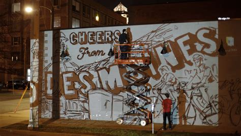 Work begins on new mural outside Exile Brewing Co.