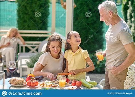 Family Preparing for the Thanksgiving Dinner and Looking Involved Stock ...