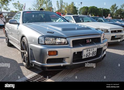 Front view of a silver tenth generation Nissan Skyline GT R34 at a ...