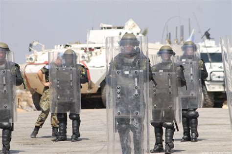FILE PHOTO: United Nations peacekeepers (UNIFIL) and Lebanese army soldiers stand guard at a checkpoint in Naqoura, near the Lebanese-Israeli border, southern Lebanon, October 27, 2022. REUTERS/Aziz Taher/File Photo