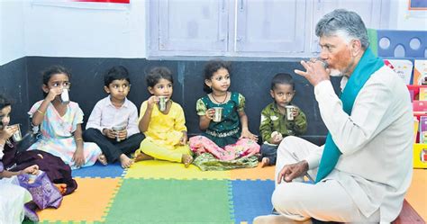 CM Chandrababu Naid shares ragi malt with kids at Anganwadi centre