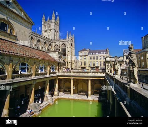 The Great Bath at the Roman Baths and Bath Abbey in Bath Somerset ...