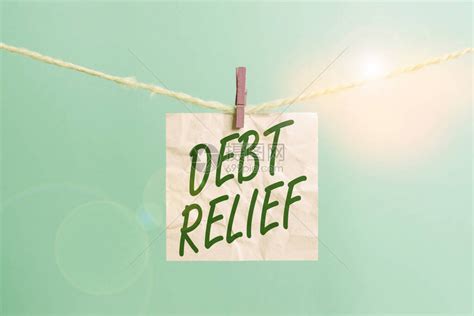 显示债务减免的文字符号展示减少一个必须支付的债务金额的商业照片晾衣绳夹矩形纸高清图片下载-正版图片504553153-摄图网