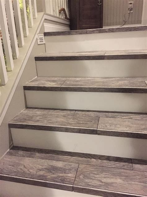 Wood look tiled stair case | Diy stairs, Tile stairs, Stair remodel