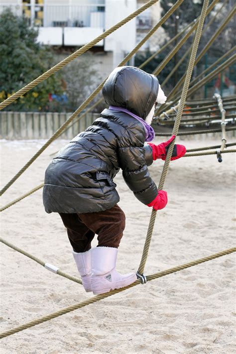 Free Images : winter, girl, play, spring, park, child, climbing ...