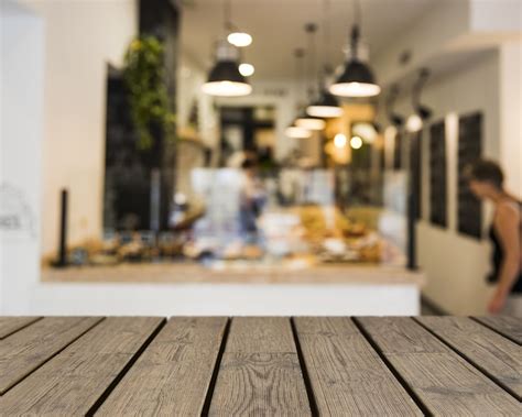 Wooden table looking out to buffet | Free Photo